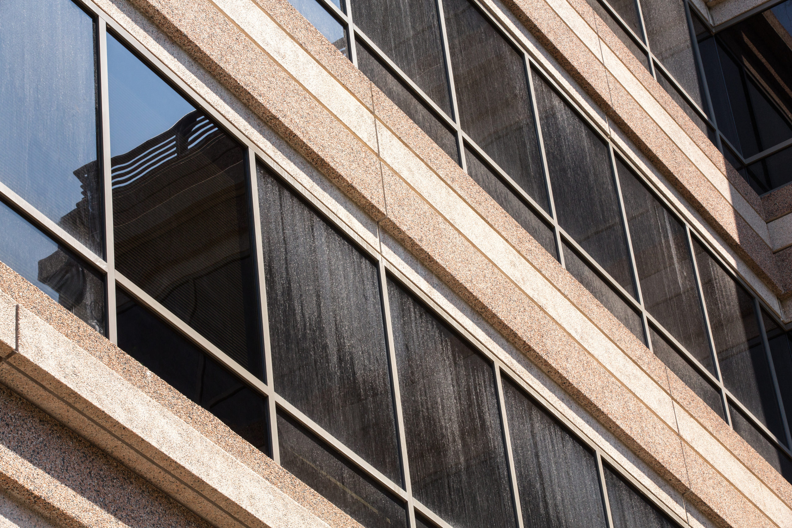 Commercial building with glass windows that need a deep cleaning